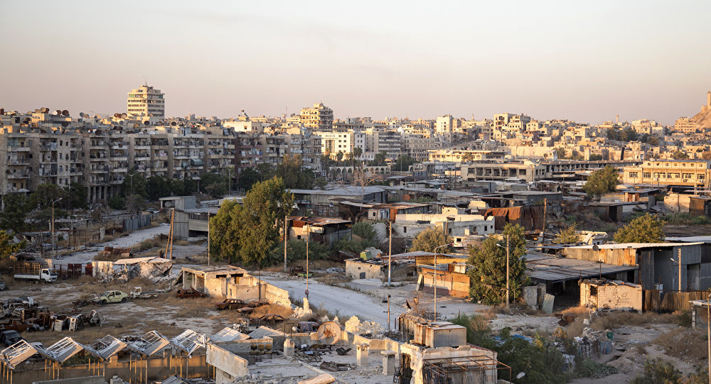 A picture taken on July 29, 2016 shows a general view of Karaj al-Hajz corridor (C) in the rebel-held part of Aleppo, leading towards the government controlled area of the Masharqa neighbourhood (background) A picture taken on July 29, 2016 shows a general view of Karaj al-Hajz corridor (C) in the rebel-held part of Aleppo, leading towards the government controlled area of the Masharqa neighbourhood (background)